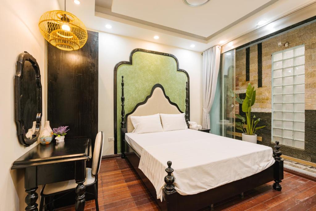 Postel nebo postele na pokoji v ubytování Sun Clover Boutique Hotel