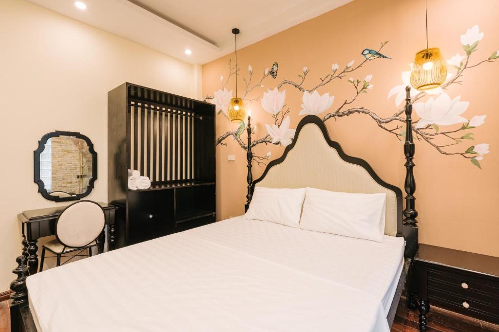 Postel nebo postele na pokoji v ubytování Sun Clover Boutique Hotel