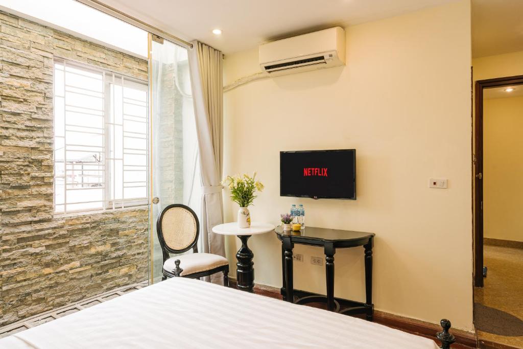 TV a/nebo společenská místnost v ubytování Sun Clover Boutique Hotel