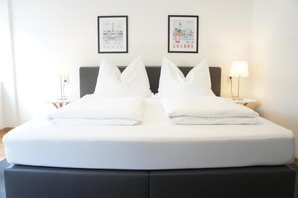 Posteľ alebo postele v izbe v ubytovaní Schwarzacherhof Pension & Apartments