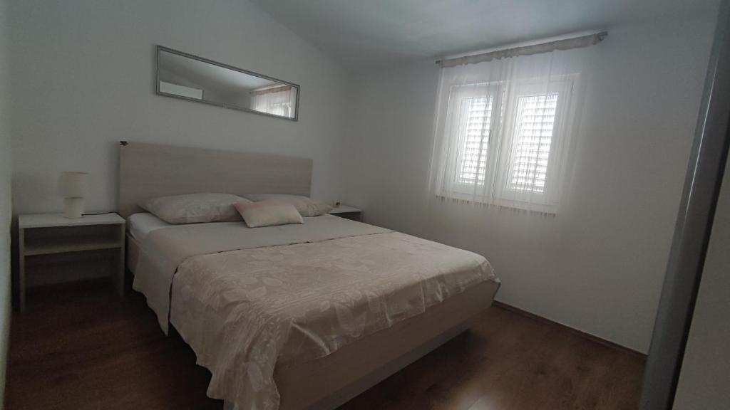 Łóżko lub łóżka w pokoju w obiekcie Apartments Ankora Vir
