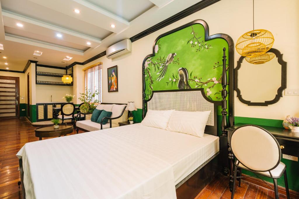 Postel nebo postele na pokoji v ubytování Sun Clover Boutique Hotel