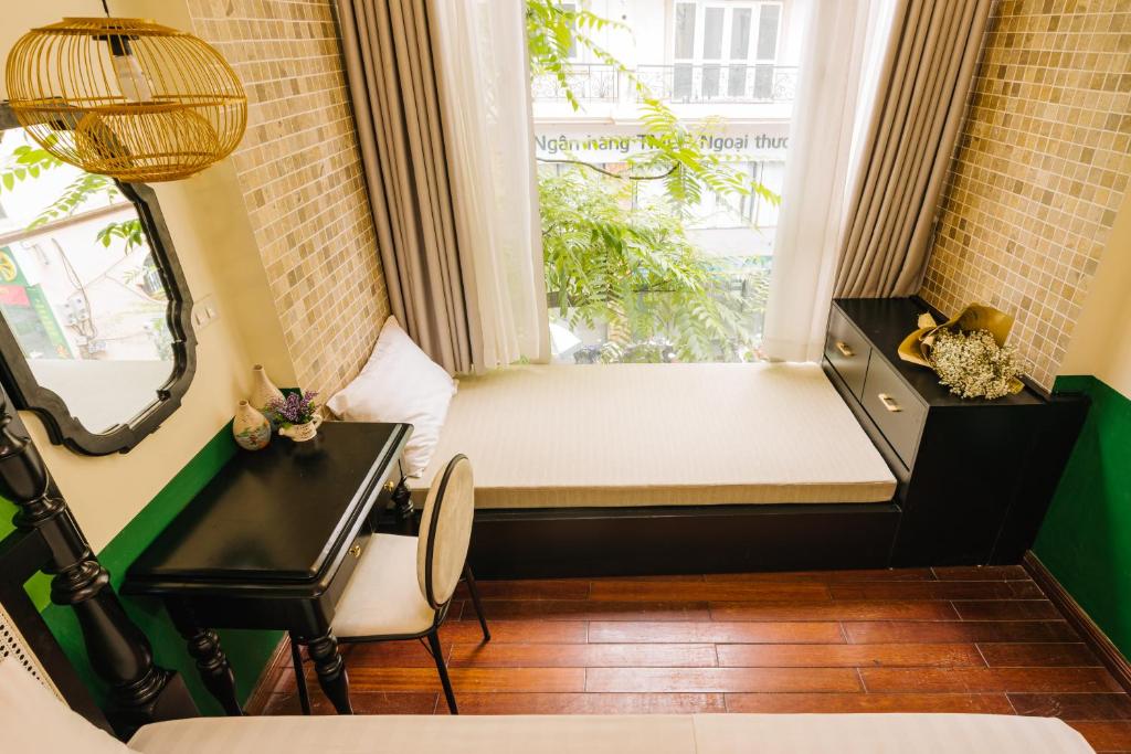 Postel nebo postele na pokoji v ubytování Sun Clover Boutique Hotel