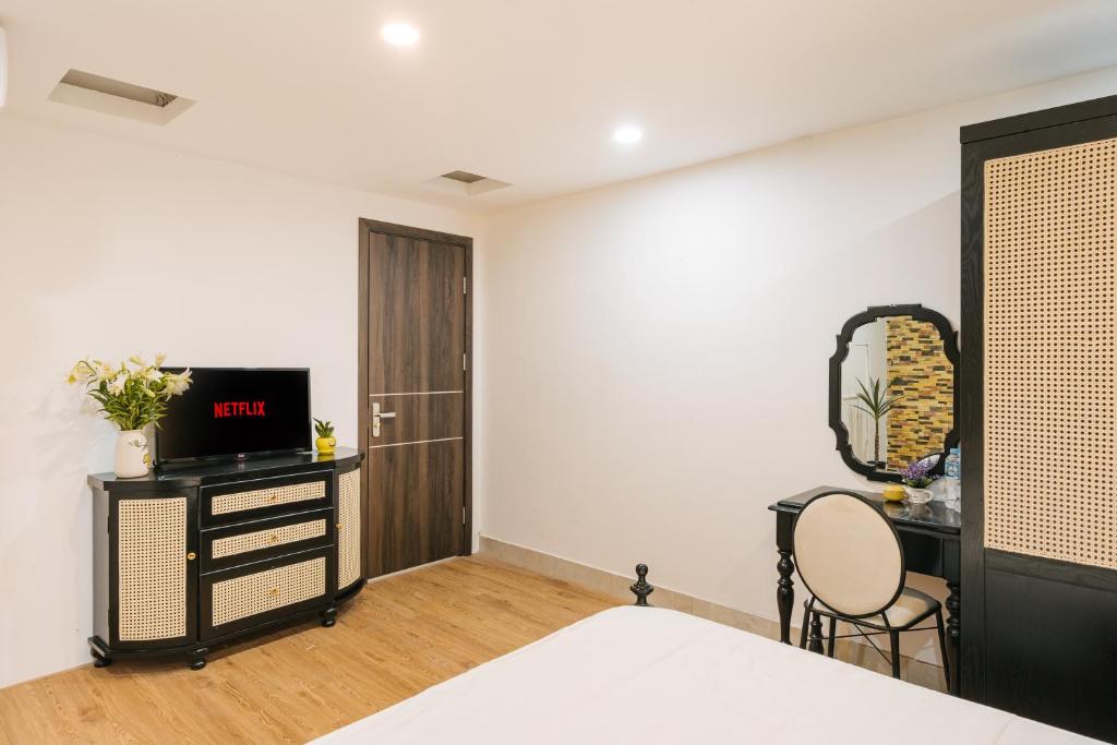TV a/nebo společenská místnost v ubytování Sun Clover Boutique Hotel