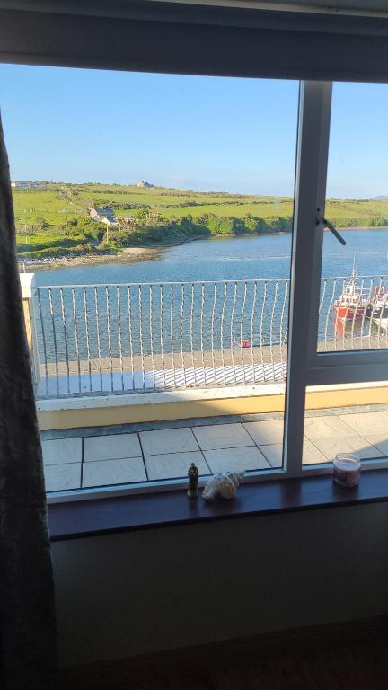 a window with a view of a large body of water at Broadhaven Bay Apartment in Belmullet