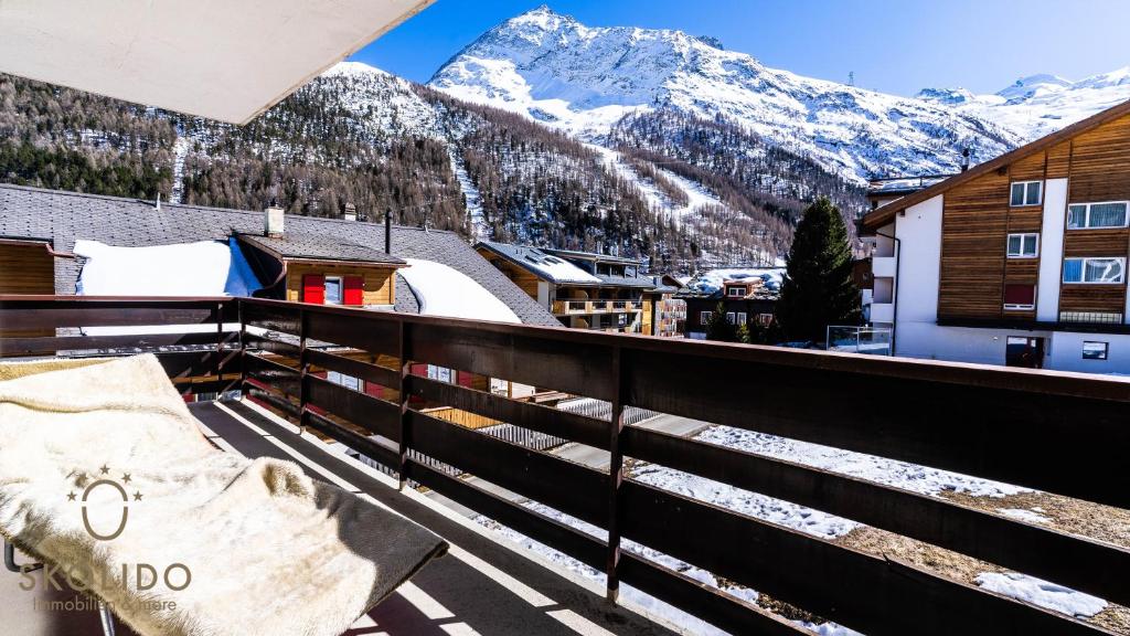 a balcony with a view of a snow covered mountain at Haus Camillo in Saas-Fee