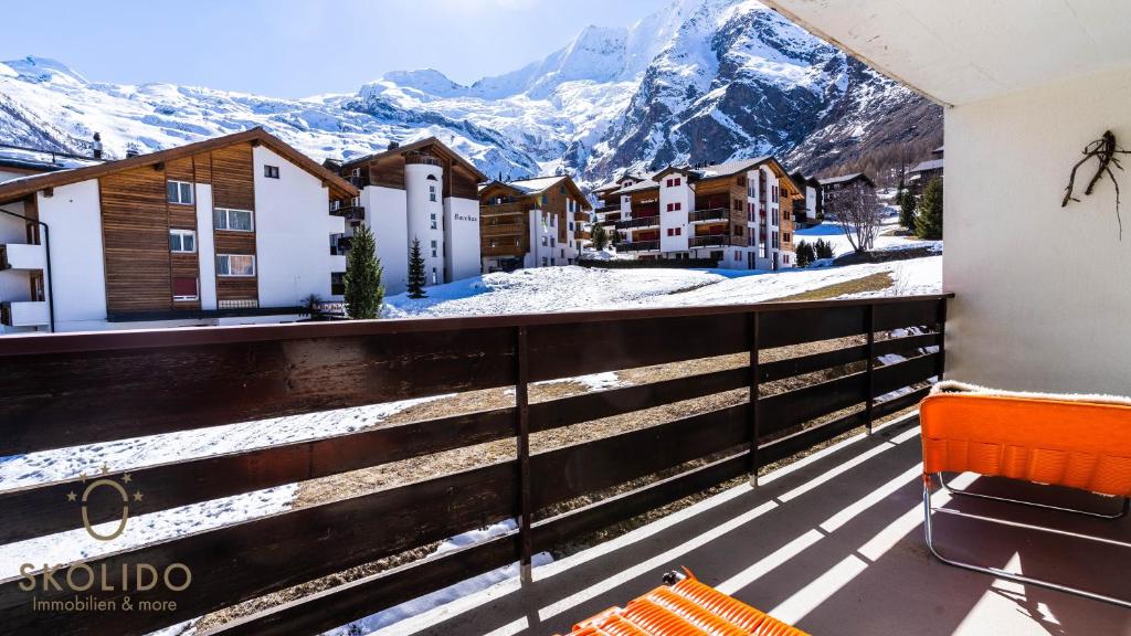 a balcony with a view of the mountains at Haus Camillo in Saas-Fee