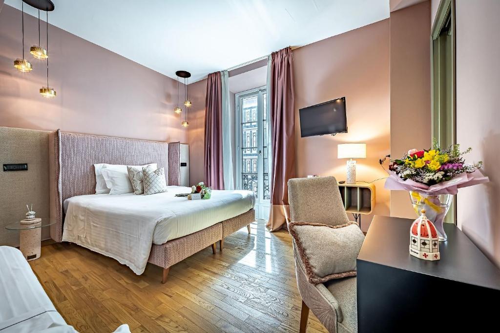 Postel nebo postele na pokoji v ubytování Hotel Duomo Firenze