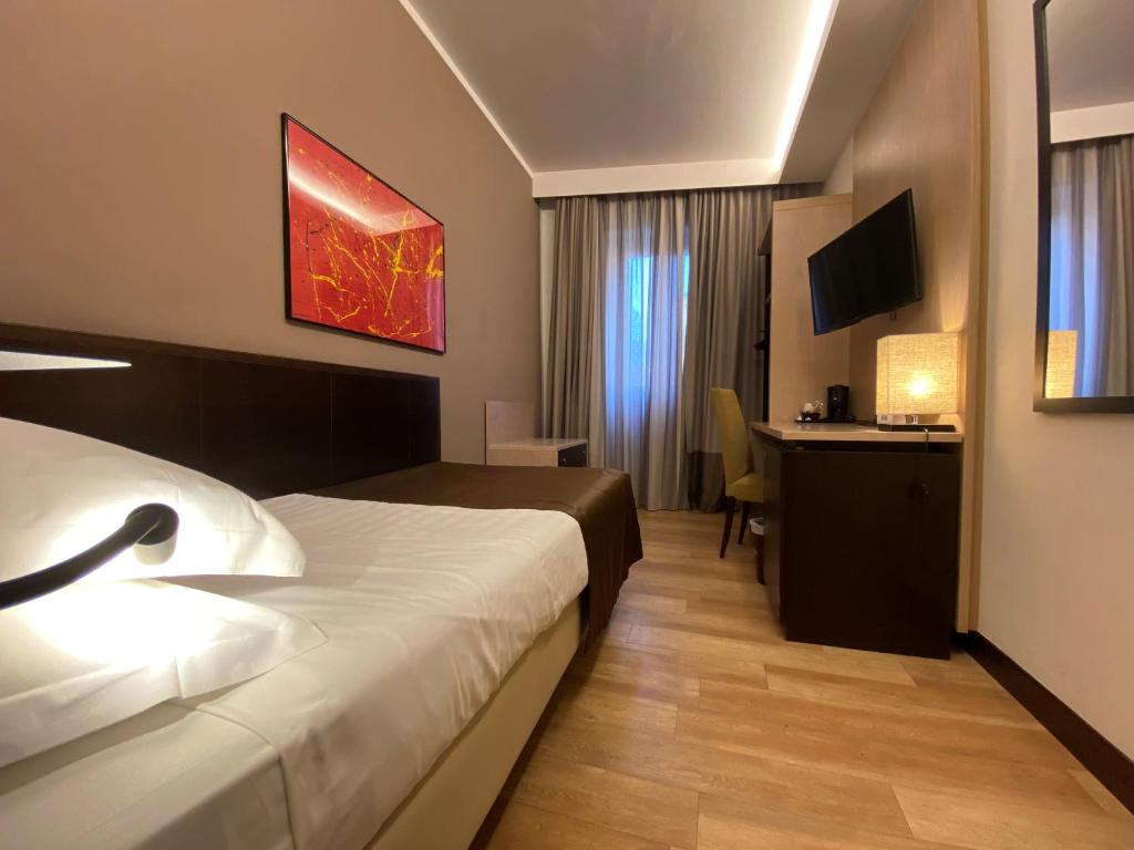TV a/nebo společenská místnost v ubytování Hotel Carlton