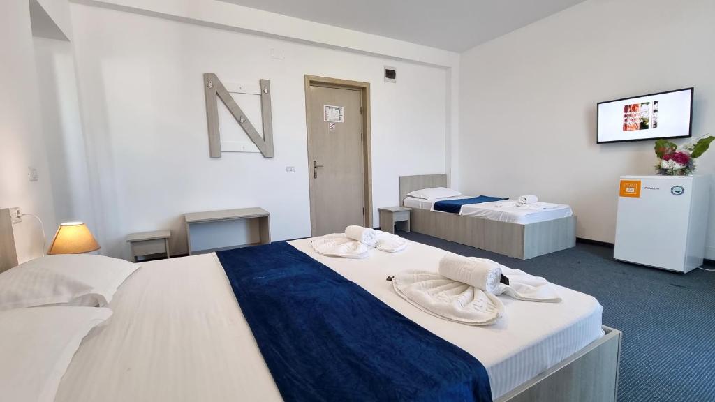 Postel nebo postele na pokoji v ubytování Neptun Resort