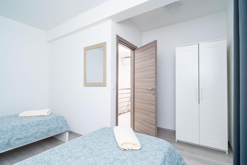 Postel nebo postele na pokoji v ubytování Apartment Olive 2