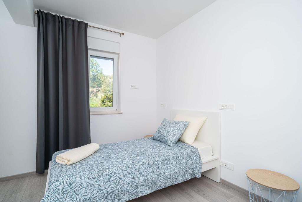 Postel nebo postele na pokoji v ubytování Apartment Olive 2