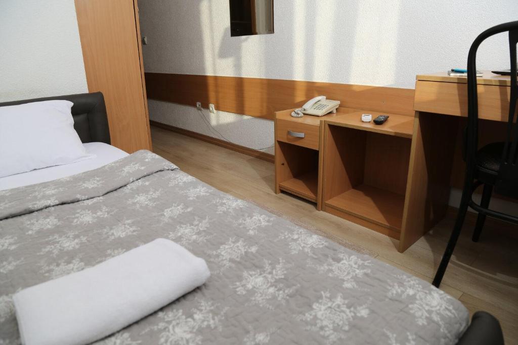Postel nebo postele na pokoji v ubytování Hotel Moment