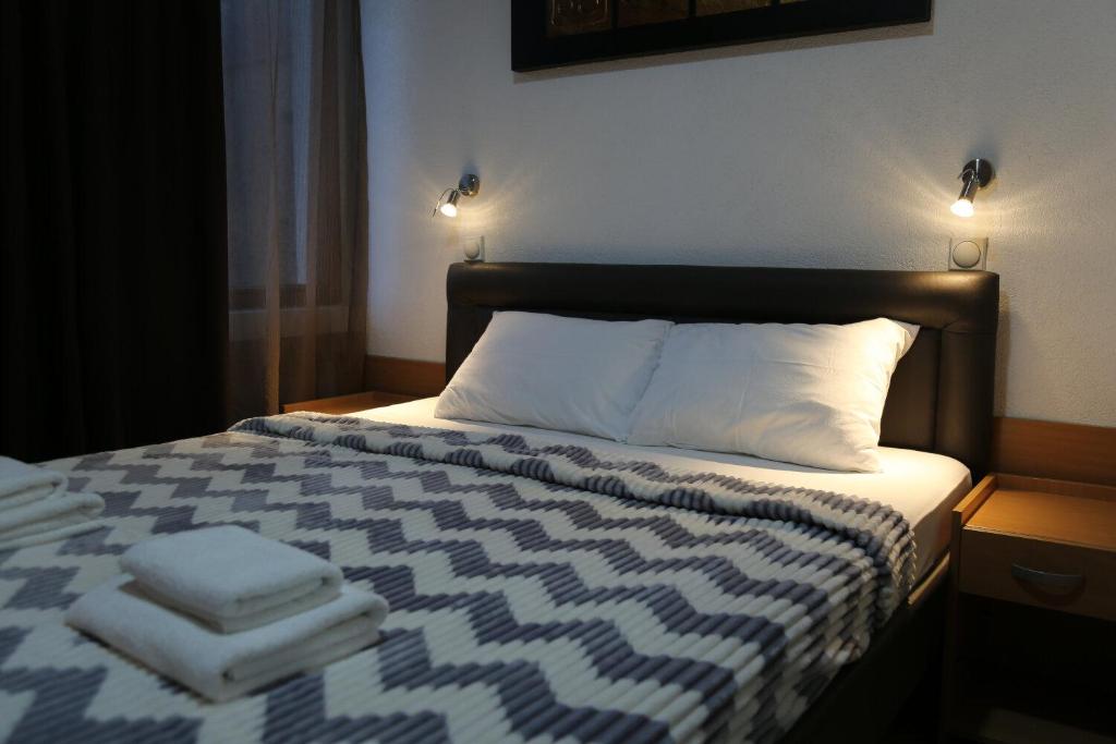 Postel nebo postele na pokoji v ubytování Hotel Moment