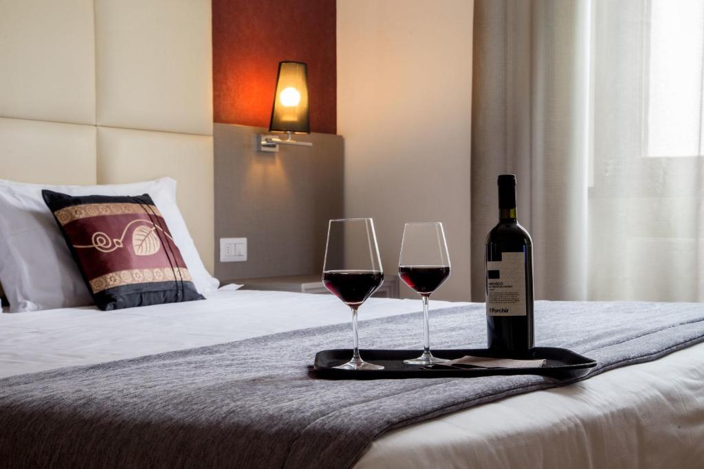 Postel nebo postele na pokoji v ubytování Hearth Hotel