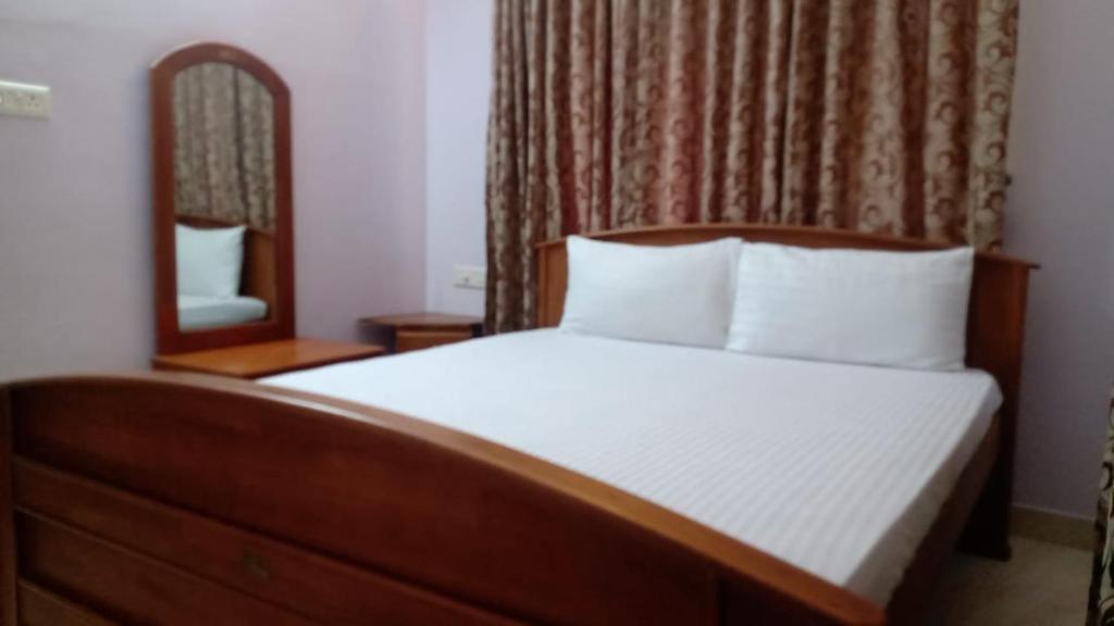 Tempat tidur dalam kamar di Atlas Home Stay