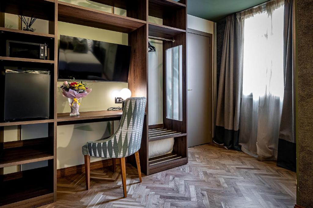 TV a/nebo společenská místnost v ubytování Hotel Duomo Firenze