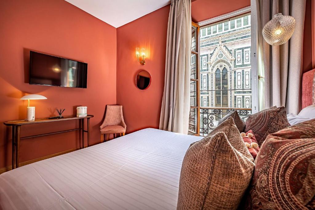Postel nebo postele na pokoji v ubytování Hotel Duomo Firenze