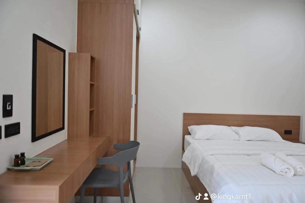 Postel nebo postele na pokoji v ubytování T-OneHome