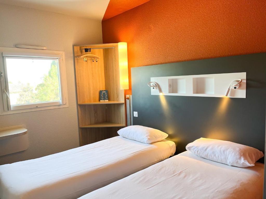 Postel nebo postele na pokoji v ubytování ibis budget Carcassonne La Cité