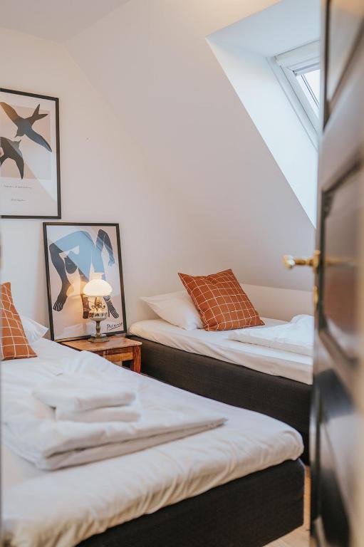 Postel nebo postele na pokoji v ubytování KEFS Guesthouse & Café