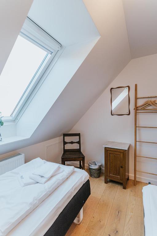 Postel nebo postele na pokoji v ubytování KEFS Guesthouse & Café