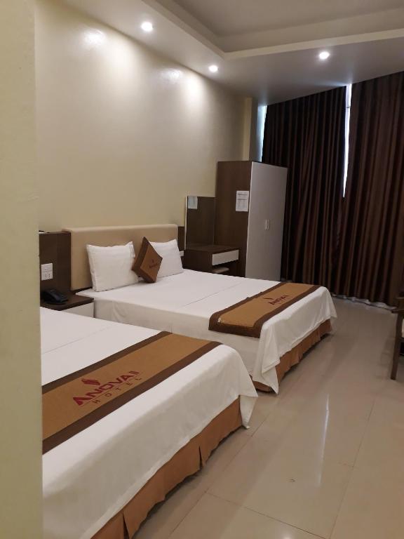 Postel nebo postele na pokoji v ubytování Anova 2 Hotel