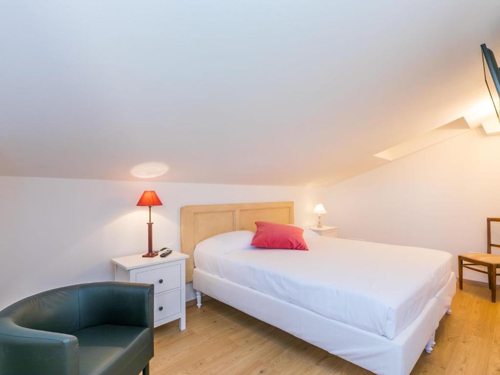 A bed or beds in a room at Holiday Home Melograno-2 by Interhome