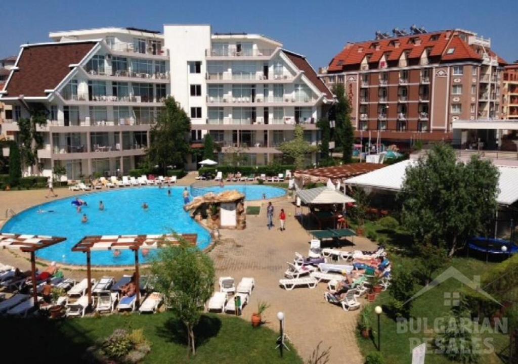 a large swimming pool in front of a large building at Charis Cozy Family apart at Sun Village Complex close to the Beach in Sunny Beach