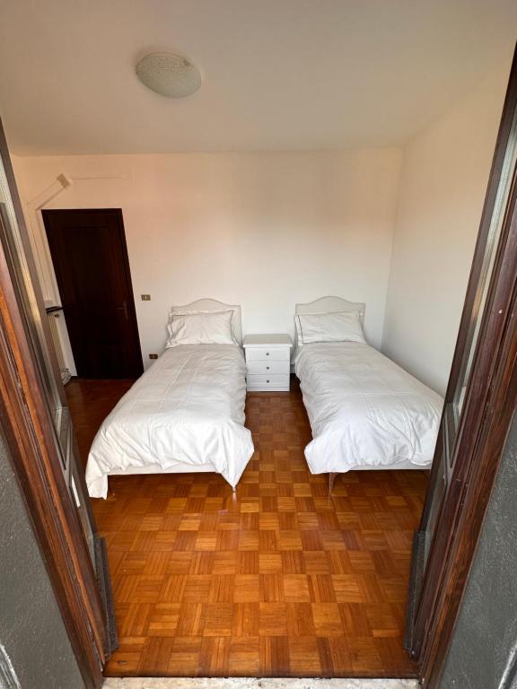 A bed or beds in a room at Appartamento Vera