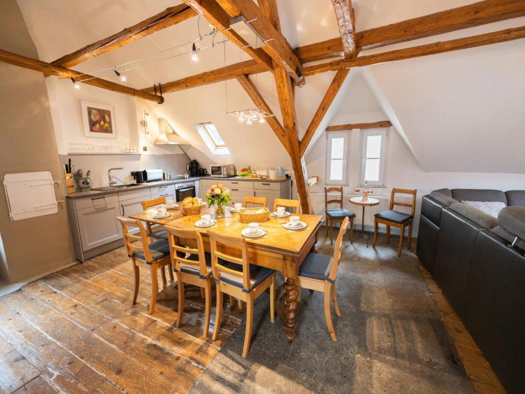 a kitchen and dining room with a wooden table and chairs at Holiday Home Tante Agnes by Interhome in Ediger-Eller