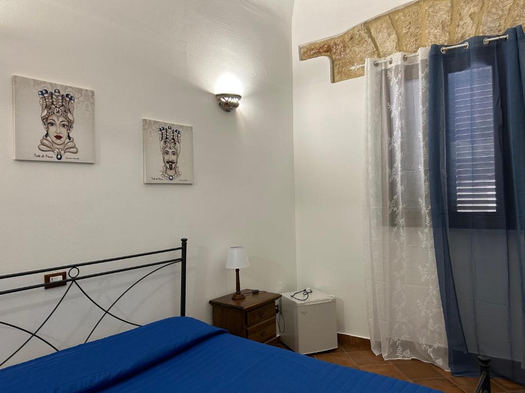 Posteľ alebo postele v izbe v ubytovaní B&B Cinisi Vacanze