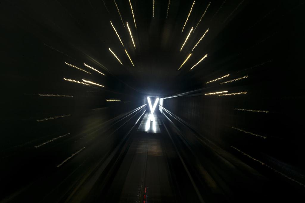 a light at the end of a tunnel at Vertigo Hotel, By Marriott, a Member of Design Hotels in Dijon
