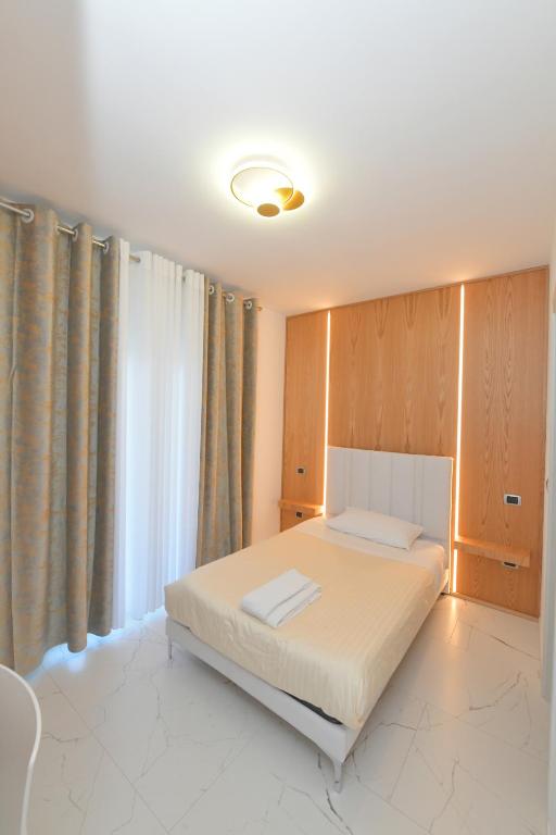 Łóżko lub łóżka w pokoju w obiekcie Noemi B&B