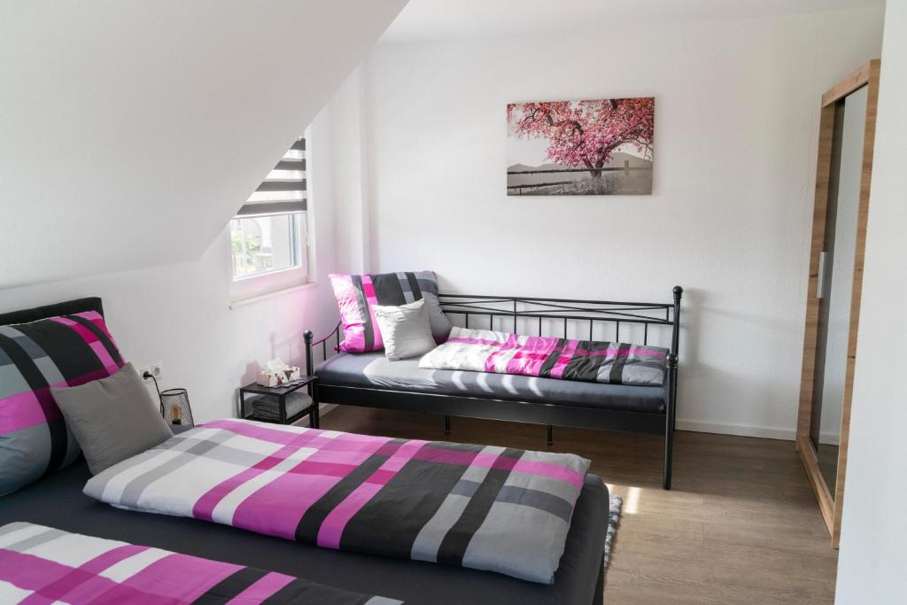 Ένα ή περισσότερα κρεβάτια σε δωμάτιο στο Villa Preisendanz