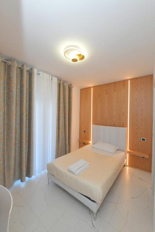Łóżko lub łóżka w pokoju w obiekcie Noemi B&B