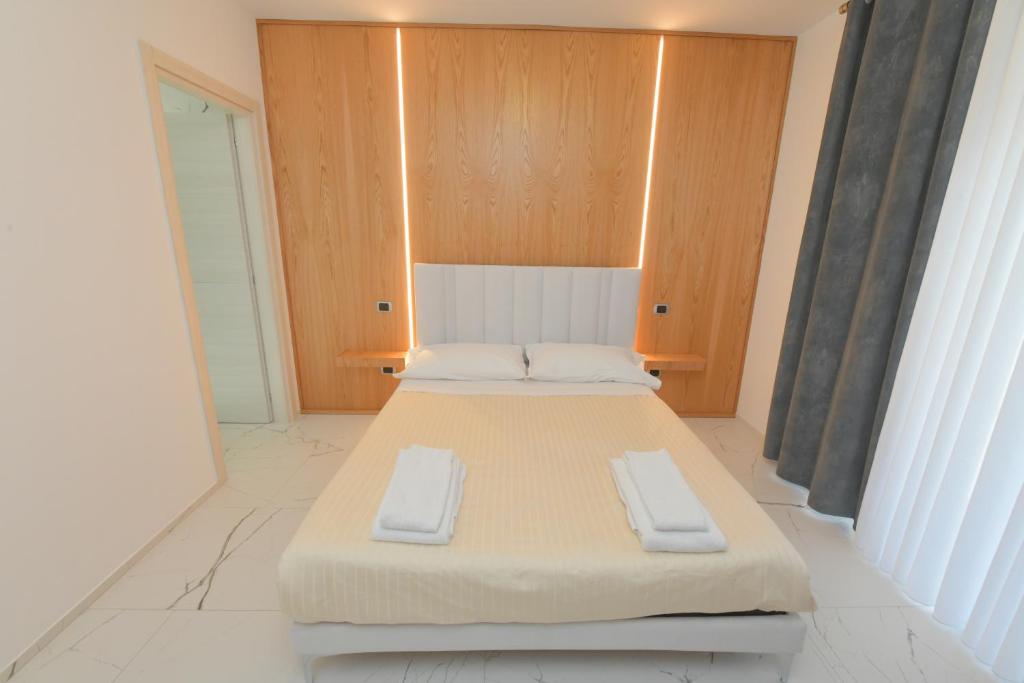 Łóżko lub łóżka w pokoju w obiekcie Noemi B&B