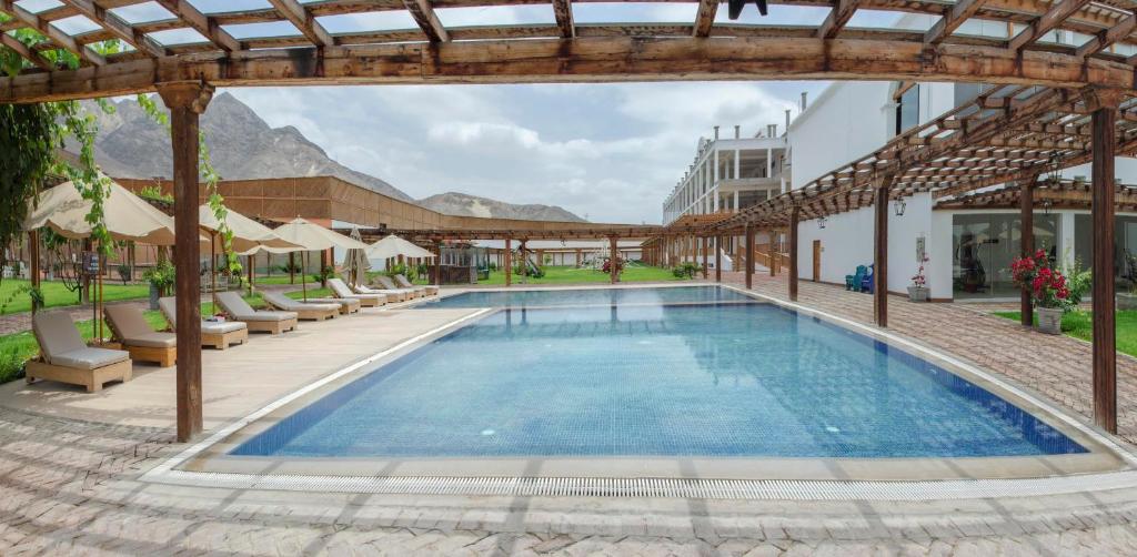 Bazén v ubytování Hotel Viñas Queirolo nebo v jeho okolí