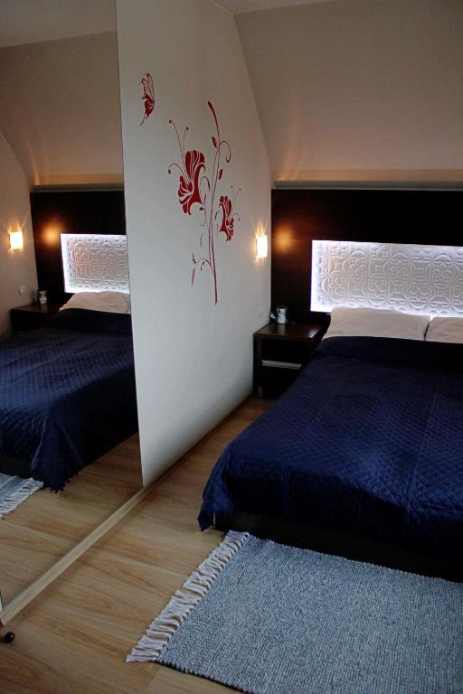 Posteľ alebo postele v izbe v ubytovaní Apartament Tatry - Kościelisko