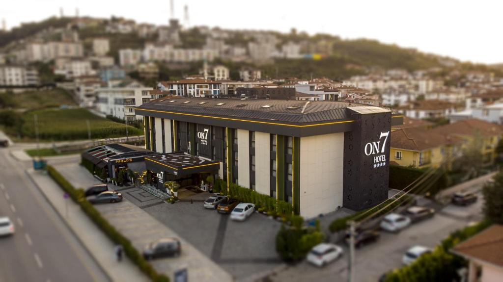 a building on the side of a street with cars at Hotel ON7 Sakarya in Sakarya