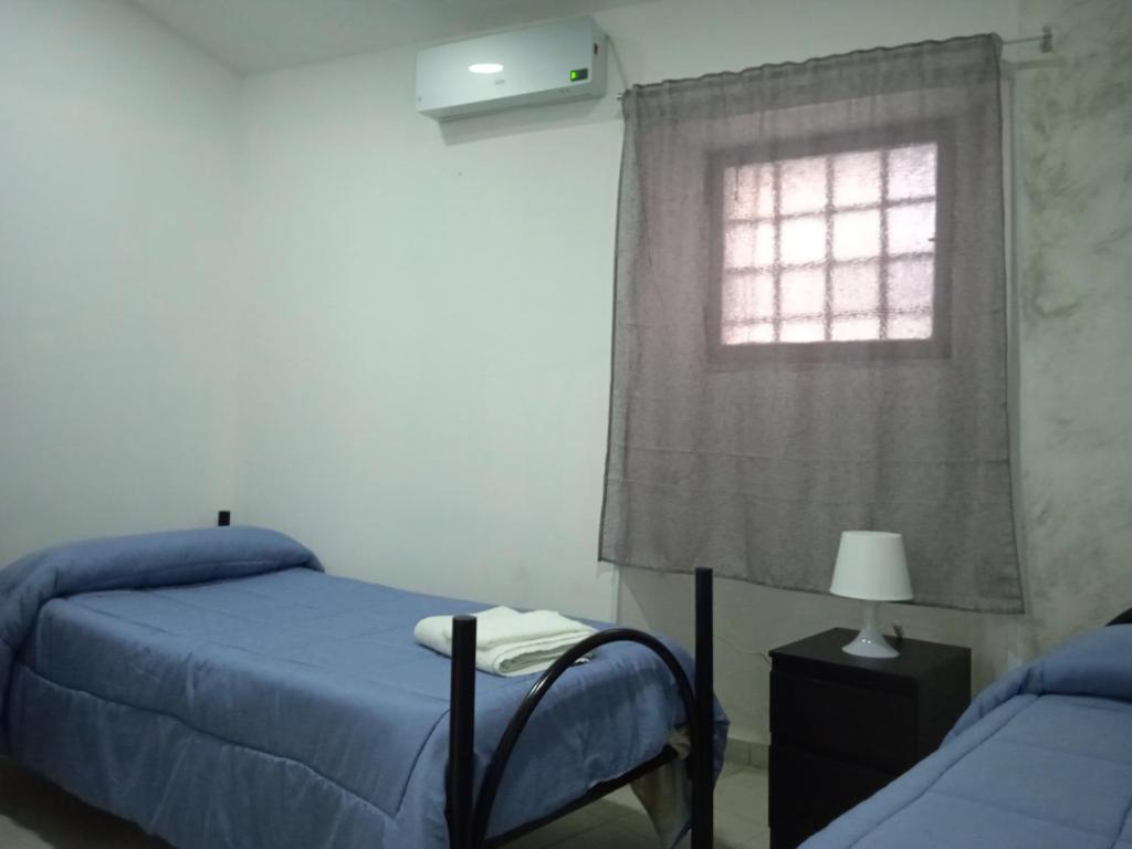 Posteľ alebo postele v izbe v ubytovaní Case Serena vacanze relax