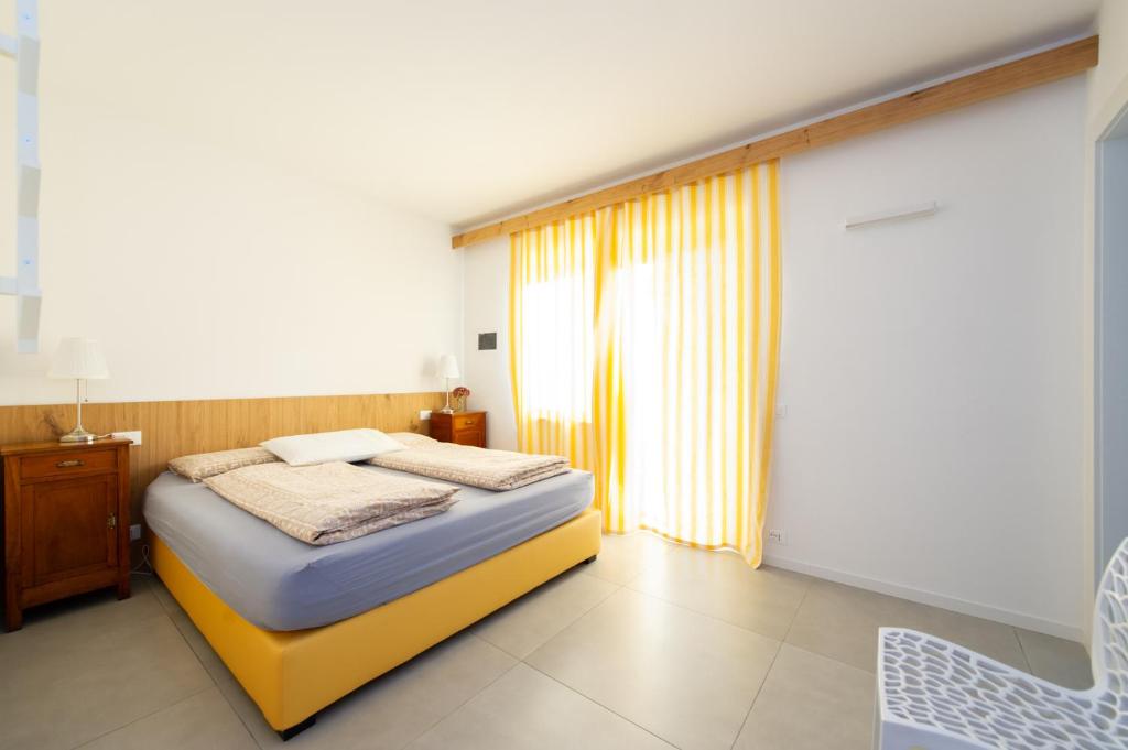 Postel nebo postele na pokoji v ubytování B&b Stregatto dalla Luna