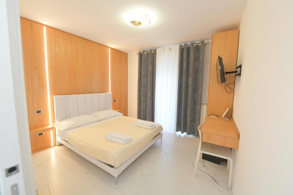 Łóżko lub łóżka w pokoju w obiekcie Noemi B&B