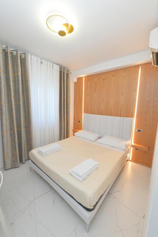 Łóżko lub łóżka w pokoju w obiekcie Noemi B&B