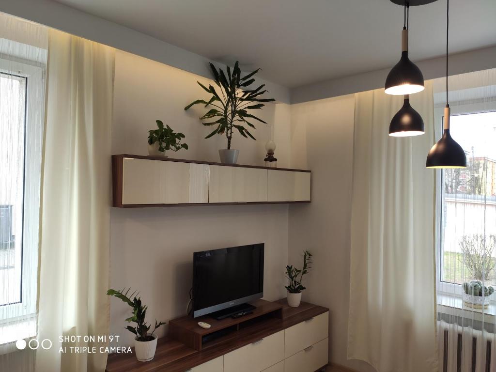 TV a/nebo společenská místnost v ubytování Apartament Centrum Kościuszko
