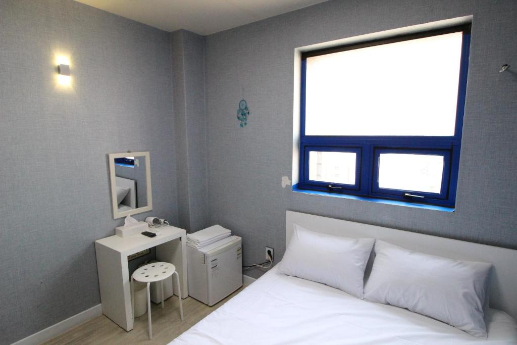 Cama ou camas em um quarto em Hotel Golden Park Myeongdong