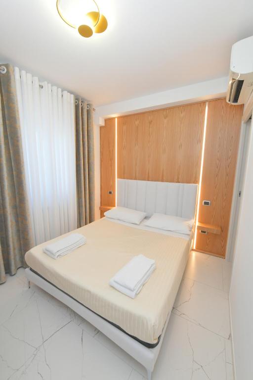 Łóżko lub łóżka w pokoju w obiekcie Noemi B&B