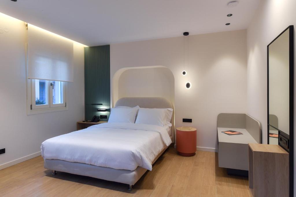 Postel nebo postele na pokoji v ubytování Zalo Urban Living Spaces