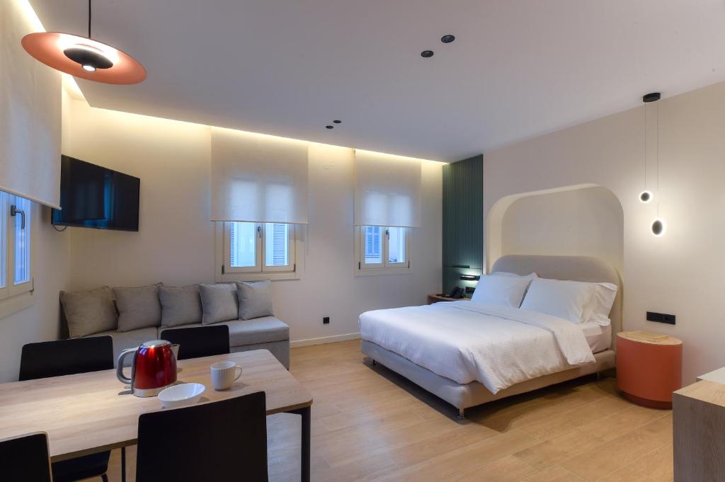 Postel nebo postele na pokoji v ubytování Zalo Urban Living Spaces