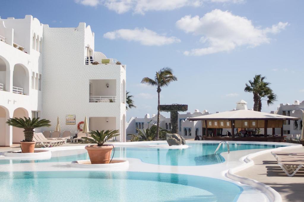 a large swimming pool in front of a building at Sotavento Beach Club in Costa Calma
